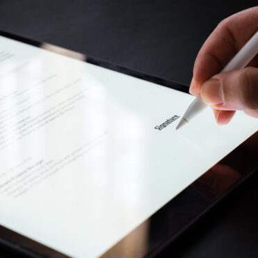 Businesswoman Signing Electronic Contract On Digital Tablet