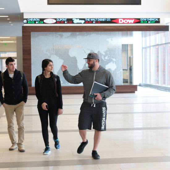 Students walking in Goodwin College of Business