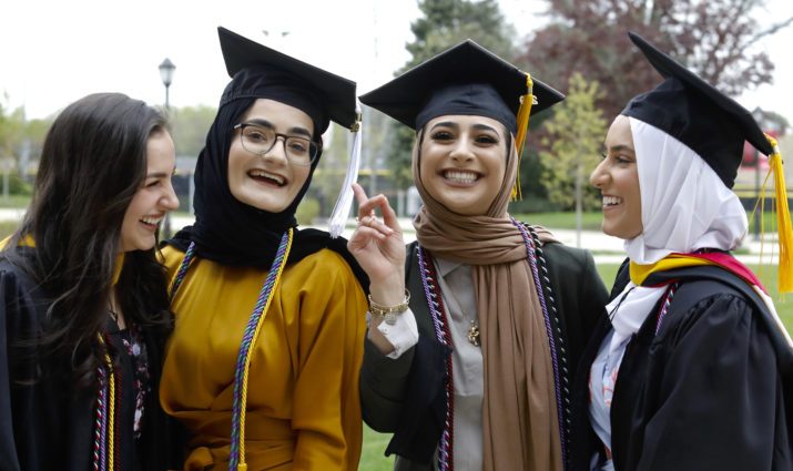 female students celebrate commencement