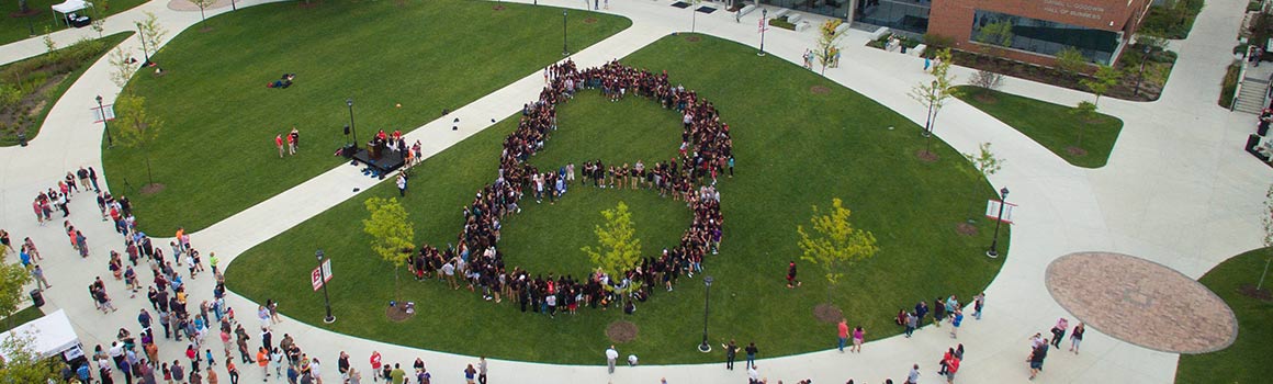 Students in the shape of a "B" on the Quad