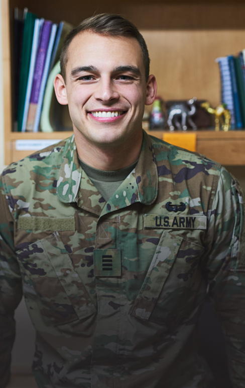 Male U.S. Army male smiling in his military clothing - military students living on campus