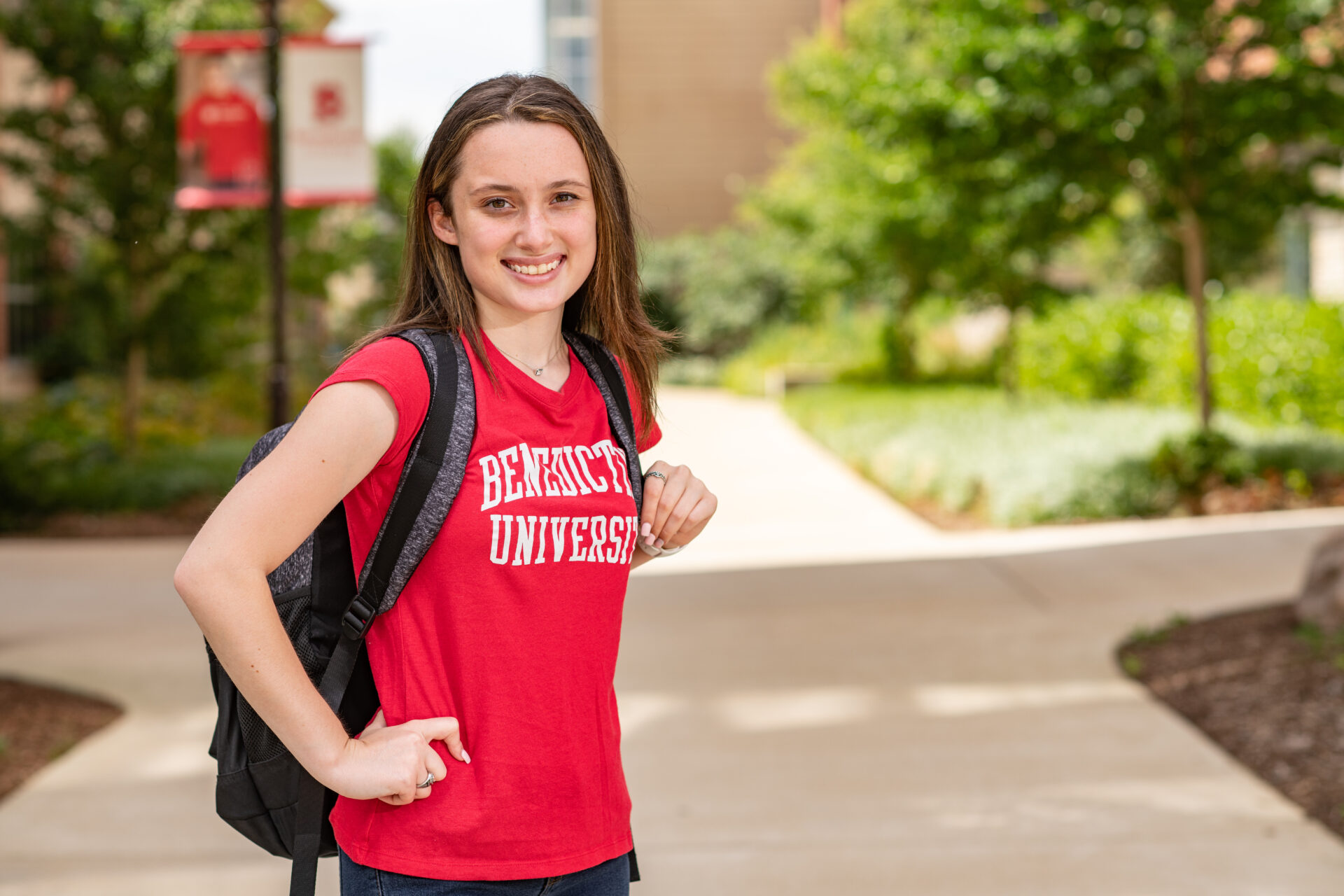 Female student on campus with backpack