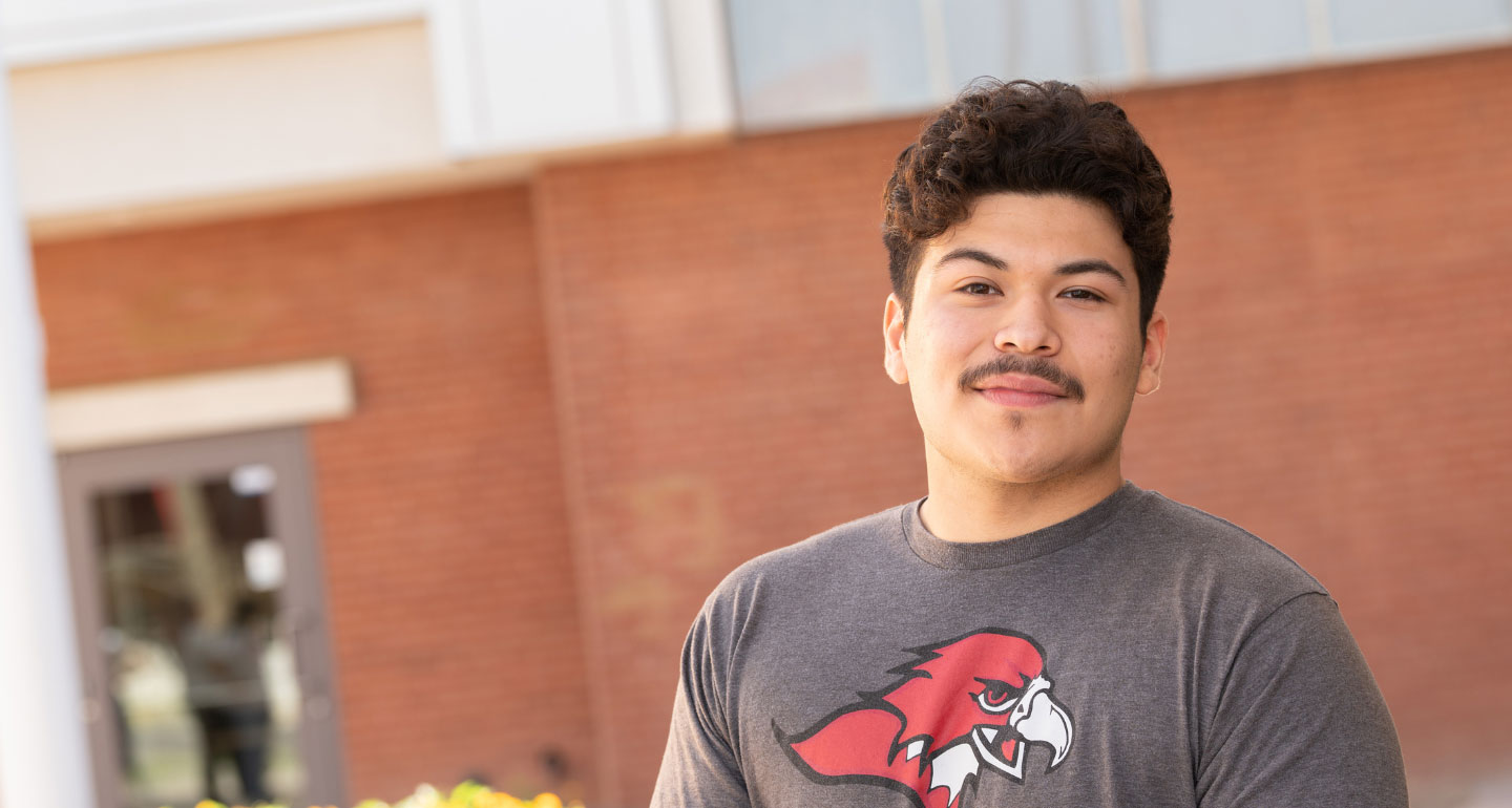 headshot of male Latino student smiling on Mesa's campus