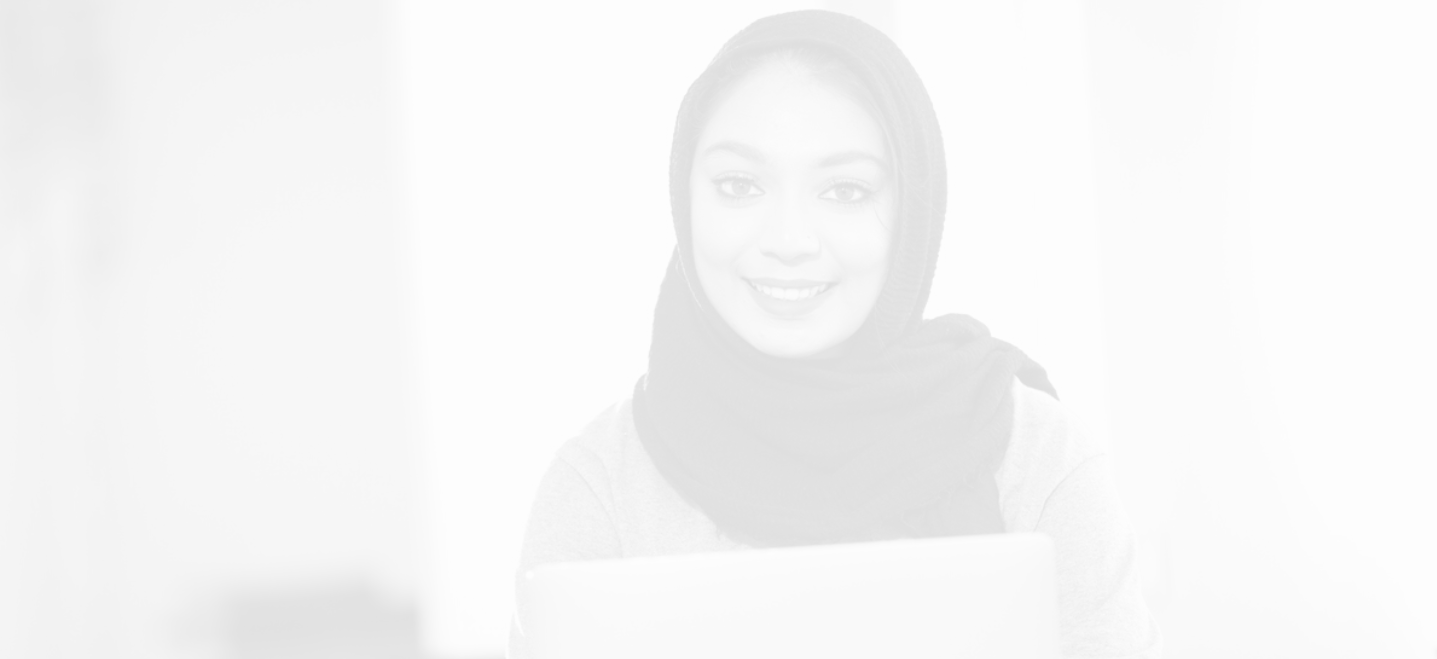 Female student with head scarf smiling; Arabic and Islamic World Studies minor background