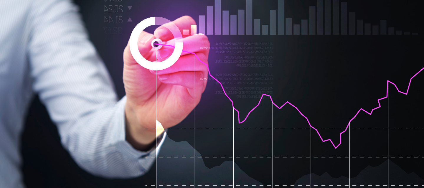 hand with light pen making a graph on a glass screen with business icons on the image; business analytics