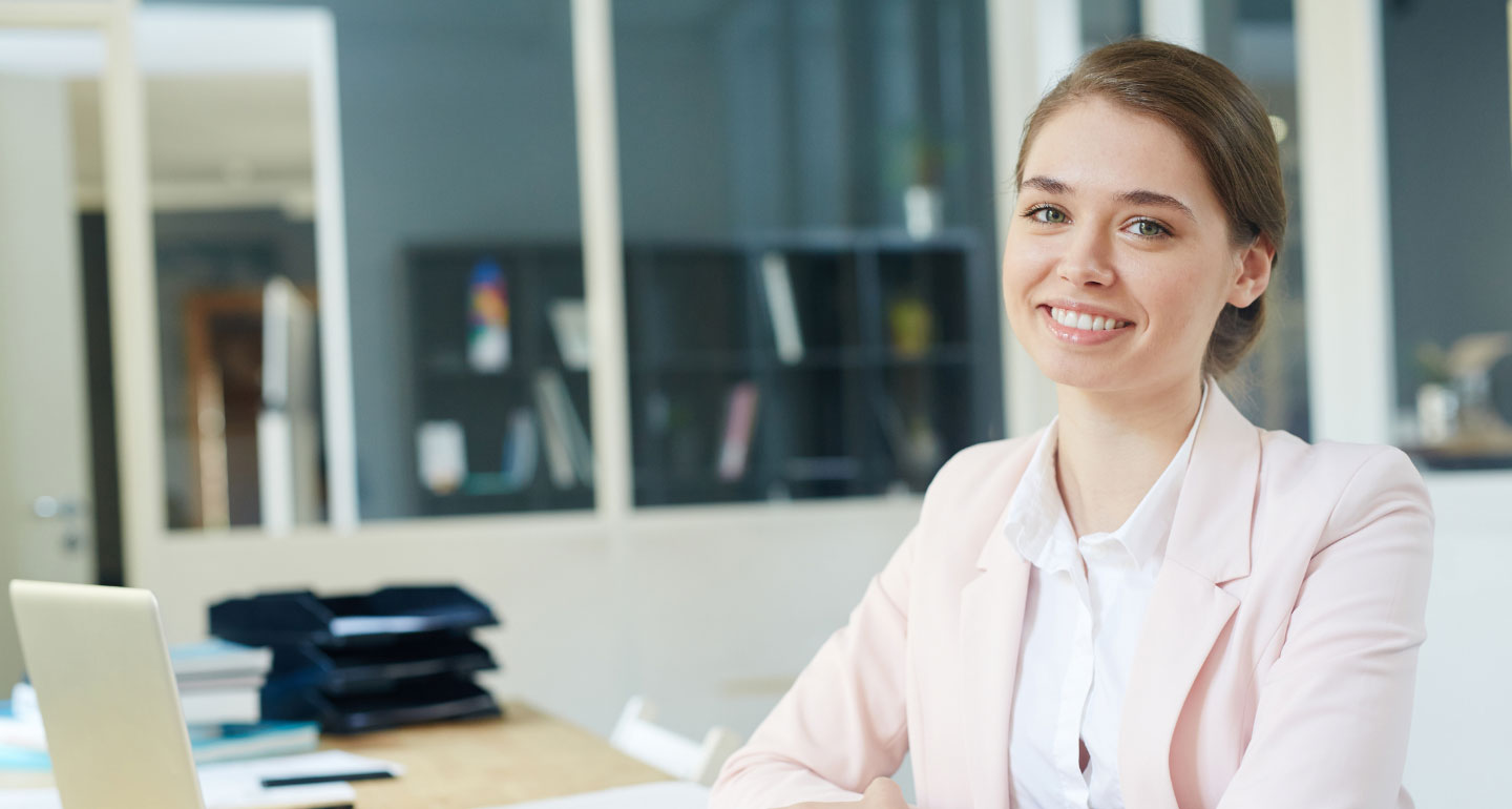 Female professional student sitting at desk, Management and organizational behavior