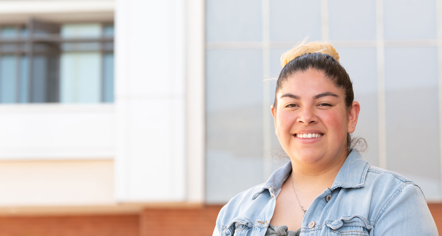 headshot of female student posing on Mesa campus