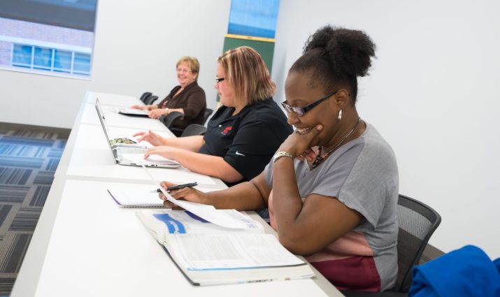 adult student in a classroom for business administration, MBA