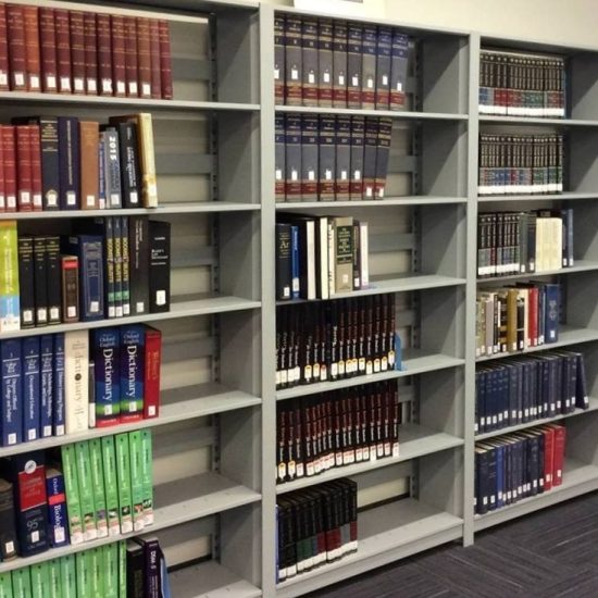 shelves of books in the library on Mesa's campus