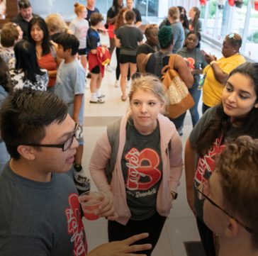 Group of students gathered in groups in Goodwin Hall for an Admissions event