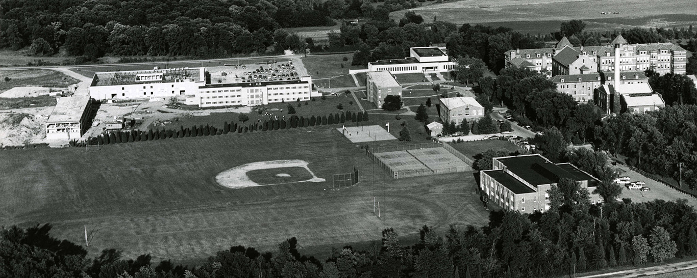 Historic black and white photo of Benedictine Campus with Ben Hall