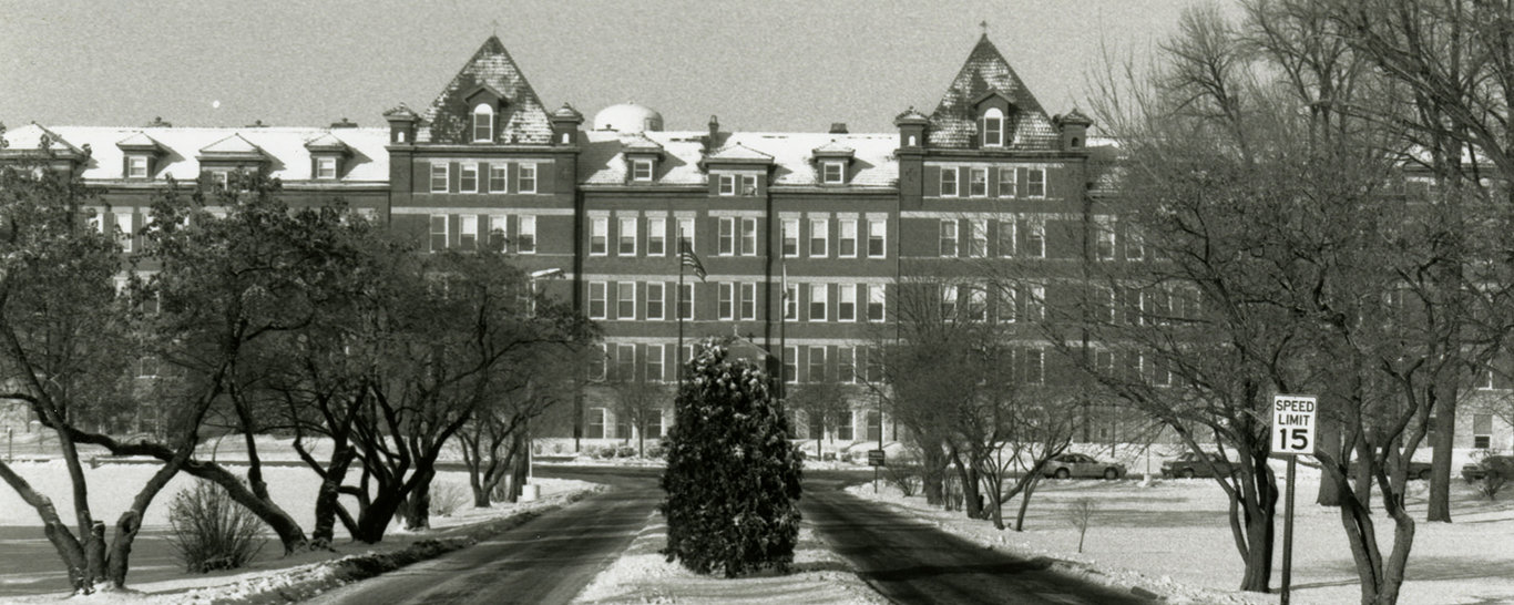 historic, black and white photo of the front of Ben Hall; archives