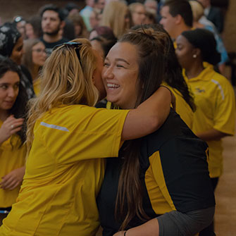 Female students hugging - Campus Ministry activities