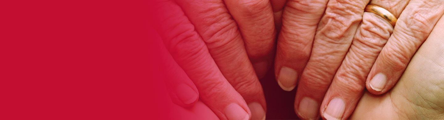 hands holding older hands with a red overlay on the left side; campus ministry