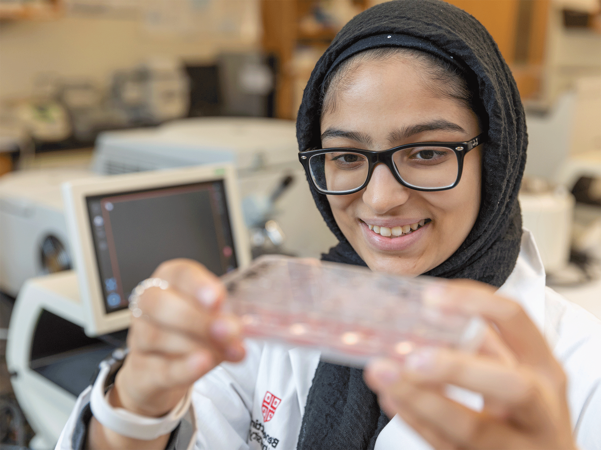 female science student looking at specimen