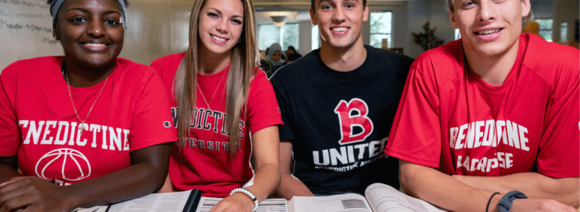 Degree programs. four Benedictine students smiling at camera while studying