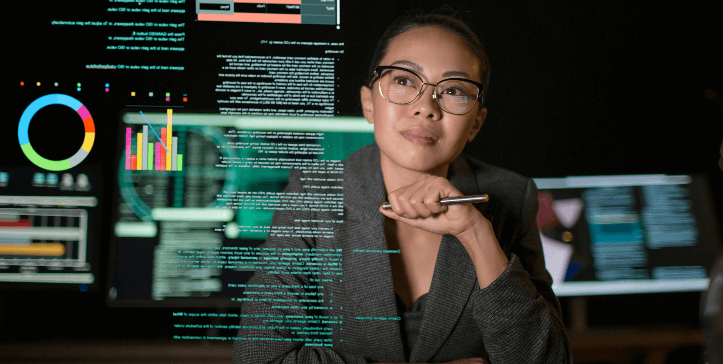 female student looking at data on a clear screen - data science program