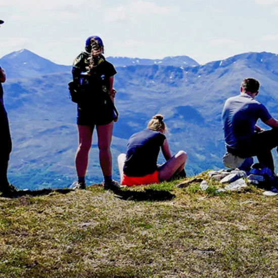 International Programs, students hiking on the top of a mountain; study abroad