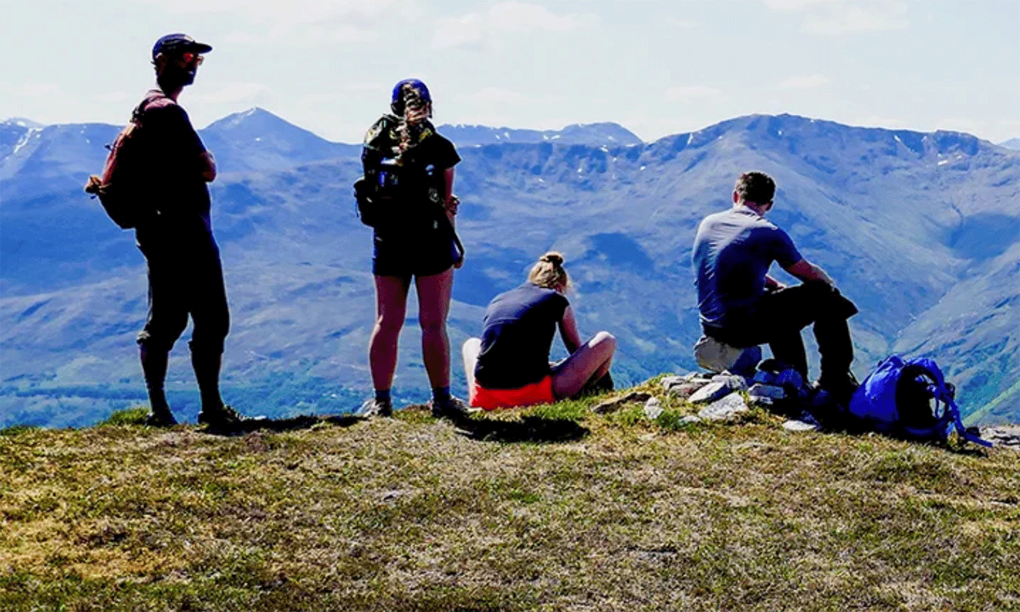 International Programs, students hiking on the top of a mountain; study abroad