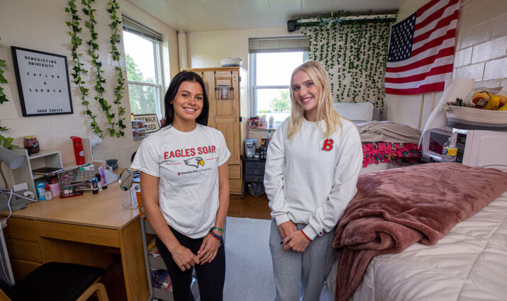 two freshmen moving into their dorm room