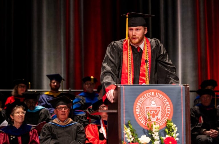 Picture of grad speaking as a class representative