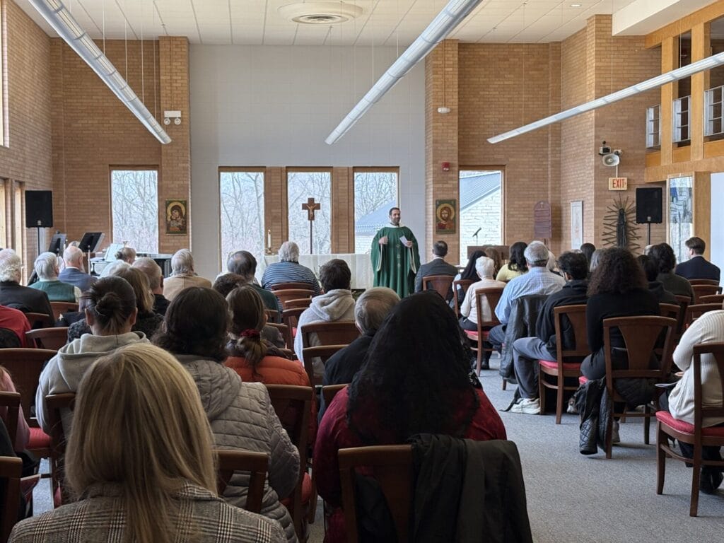 Image of Benedictine University's St. Benedict Chapel with Fr. Nick Kleespie