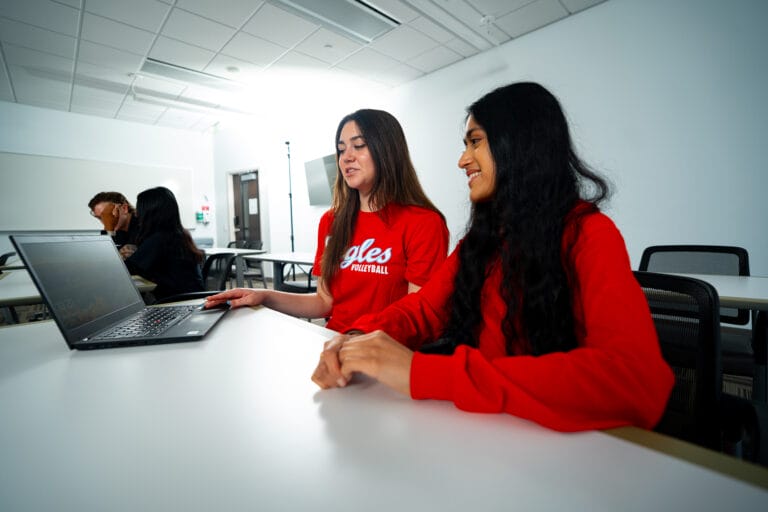 two female students learning for their Spanish for Mental Health Minor