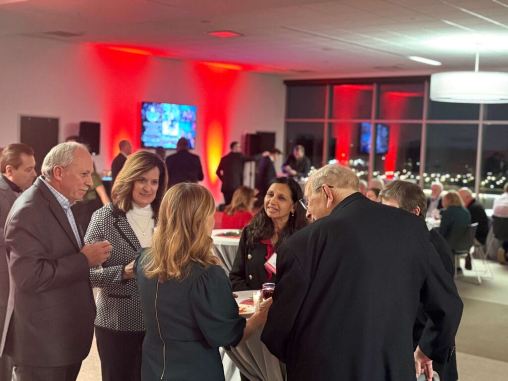 photo of guests at benedictine university for the president's circle holiday reception. multiple individuals were in attendance for this gathering