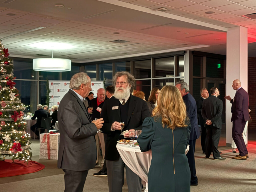 photo of guests at benedictine university for the president's circle holiday reception. multiple individuals were in attendance for this gathering
