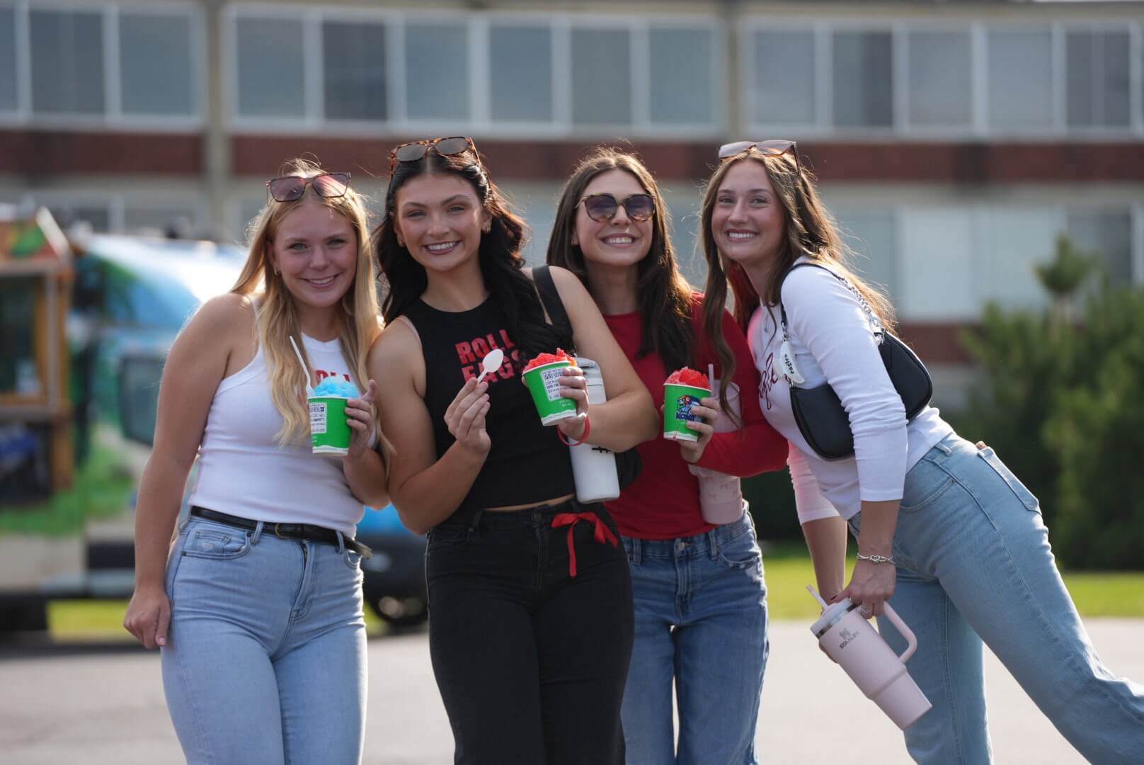 BenU students enjoying Kona Ice during tailgate