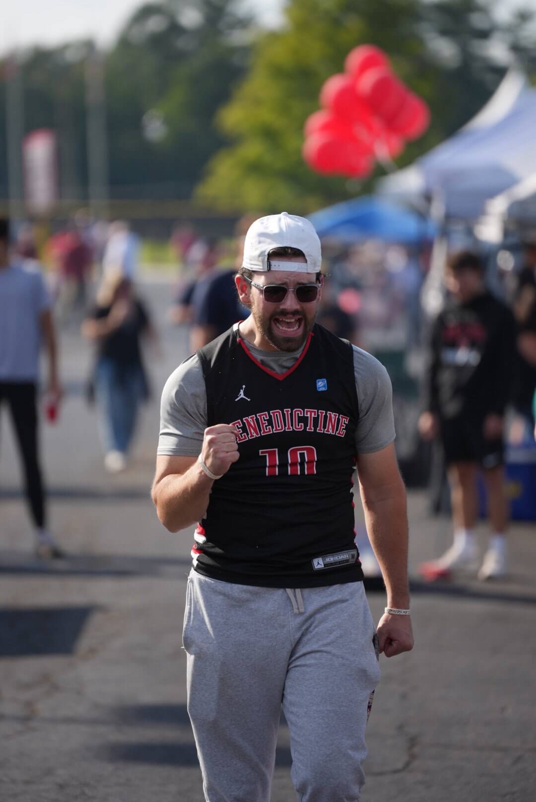 BenU student celebrating at the Homecoming tailgate