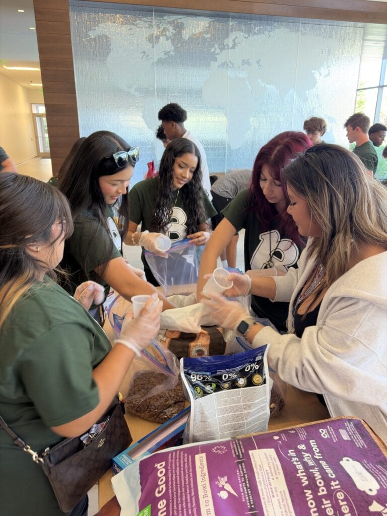 image of BenU students helping sort food for an animal shelter