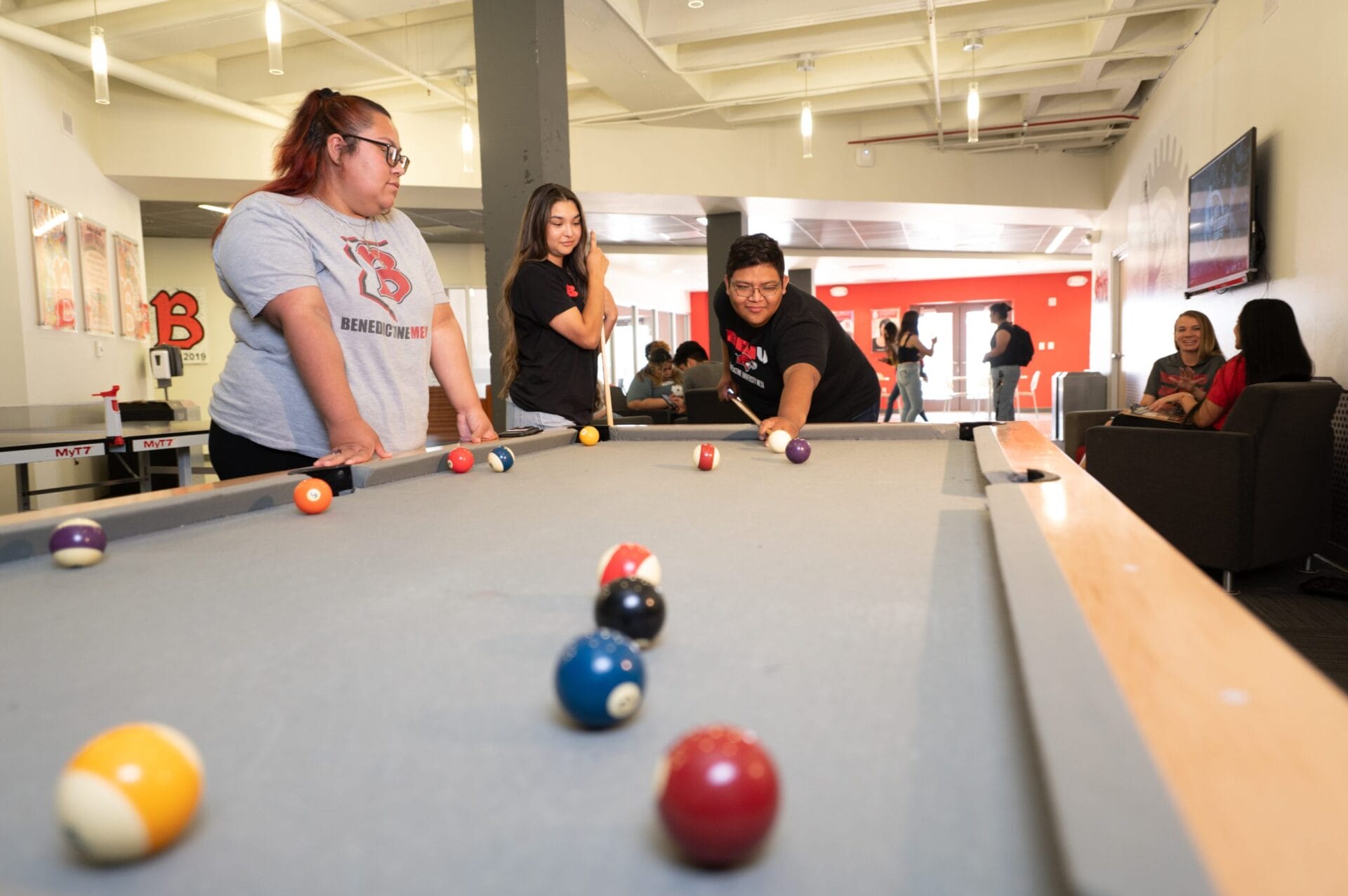Mesa students playing pool in common area