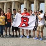 Study Abroad fee based, Study Abroad group of students posing with B flag