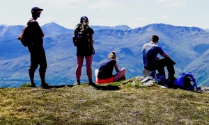 students hiking on the top of a mountian